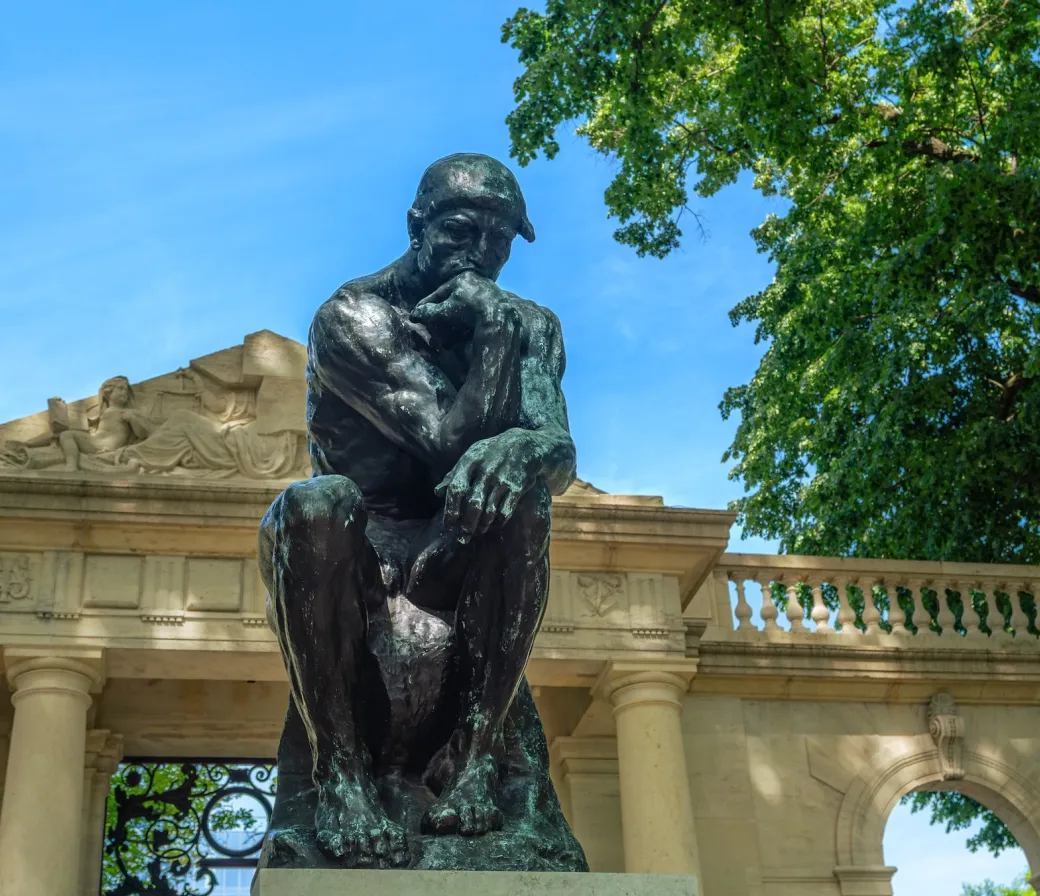 Thinker statue up close on a sunny day at the Rodin Museum in Philadelphia. (Image via Shutterstock.com)