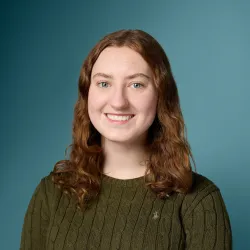 Headshot of Maggie Woods