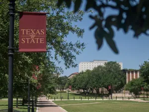 Texas State University banner and campus