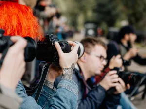 Student journalist taking a photograph
