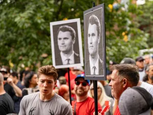 Charlie Kirk posters at an anti-immigration rally in Canada in September 2025.