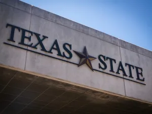 Texas State University logo on a building
