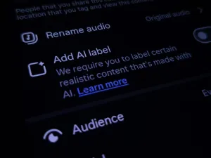 Close up image of Instagram on a smartphone with "Add AI Label" to ensure transparency on created content. (Image via Shutterstock.com)