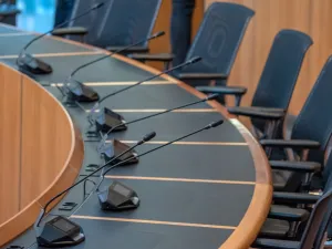 Empty seats for a city council meeting (Image via Shutterstock.com)