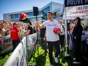 Charlie Kirk tossing hats before his last speech to Utah Valley University. (Image via Shutterstock.com)