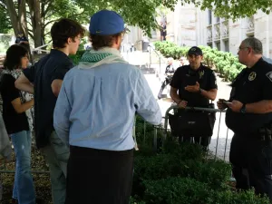 Protestors seen in heated conversation with the Pittsburgh Police at the encampment held at the University of Pittsburgh between Police on the Cathedral of Learning lawn.