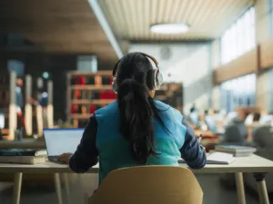 student in library