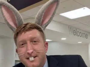 Wolverhampton Tory councillor Simon Bennett, wearing AI-generated bunny ears, whiskers, and teeth.