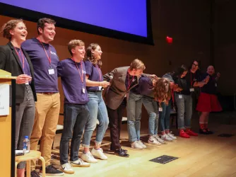 2022 Intern Class taking a bow after leading a session at the Summer Conference