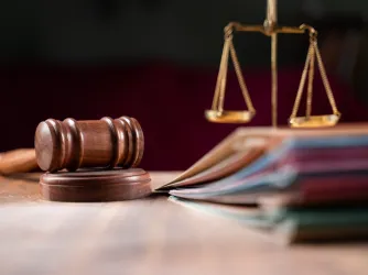 gavel and scales of justice on a table