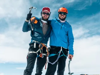 Alex and Connor on the summit of Middle Teton mid-way through Teton Trifecta