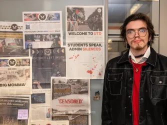 Retrograde editor Gregorio Olivares Gutierrez standing in front of old newspapers
