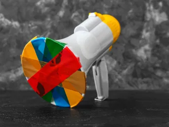 Taped megaphone on dark table