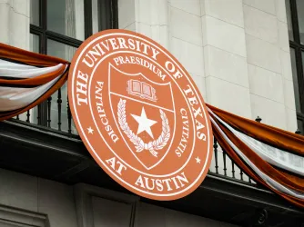 The University of Texas at Austin academic seal on the outside of a campus building
