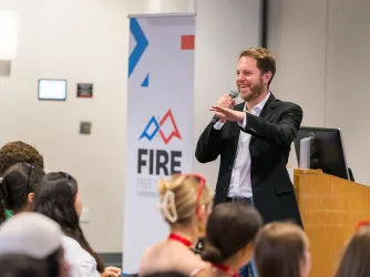 FIRE Legal Director Will Creeley speaking at the 2024 Free Speech Leadership Summit
