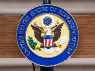 Official seal of the US House of Representatives on a podium