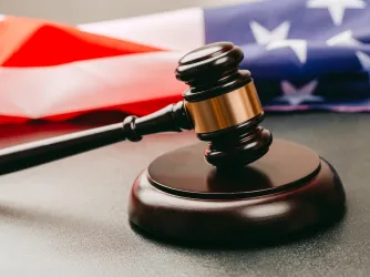 Judge gavel and background with American flag