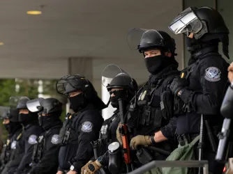 Los Angeles, California, USA - June 10, 2025: U.S. Customs and Border Protection (CBP) field officers guard a federal building during ICE deportation protests in Downtown LA. 