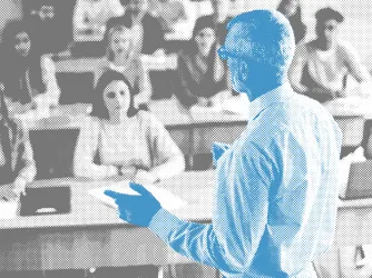 Black and white photo of students in a college lecture hall looking at a professor who is shaded blue.