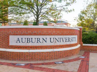 Auburn University sign on campus in Alabama (Image via Shutterstock.com)