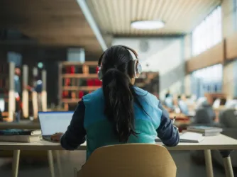 student in library