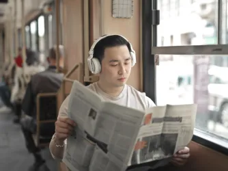 student reads newspaper