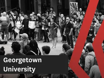 Black and white photo showing students and faculty protesting on a college lawn.
