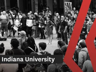 Black and white photo showing students and faculty protesting on a college lawn.