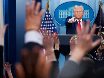 Trump calls on a reporter as other reporters raise their hands