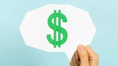 Dollar sign inside a thought-cloud as a metaphor for a person thinking about money