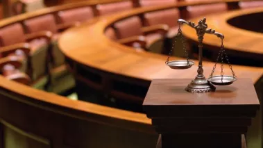 scales of justice in a courtroom