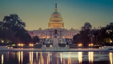 Panoramic image of the Capitol of the United States with the capitol reflecting pool in morning light