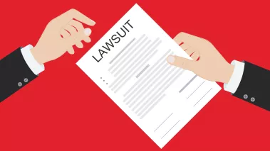 A hand passing a paper with "lawsuit" written on the top of it to another hand.