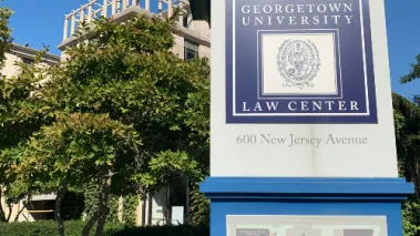 Georgetown University School of Law sign in front of main entrance to administrative building