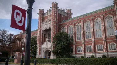 University of Oklahoma campus banner and Evans Hall 