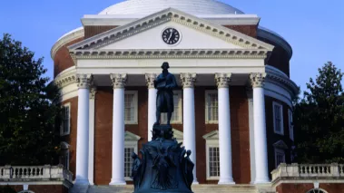 Statue University of Virginia campus with statue of Thomas Jefferson in the foreground and the Rotunda in the background