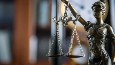 Law and Justice concept with gavel and scale in background in court library