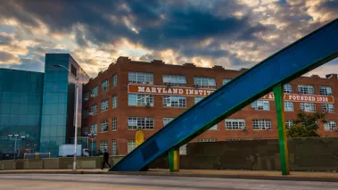 Sunset sky over the Howard Street Bridge and buildings at the Maryland Institute College of Art in Baltimore, Maryland.