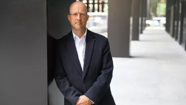 University of Illinois Chicago law professor Jason Kilborn leaning against a pillar.