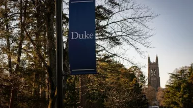 Duke University banner with admissions building in background.