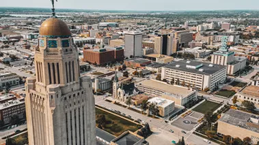 Aerial drone photograph of the Nebraska state capitol building in Lincoln