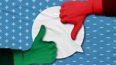 Thumbs up and thumbs down over a speech bubble