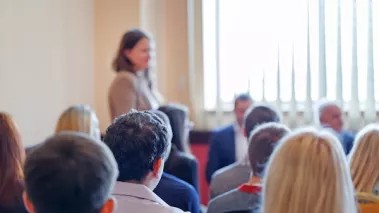 Adult students listen to speaker
