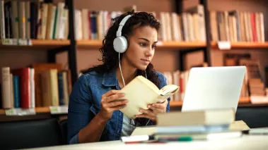 Student studying in a LIBRARY