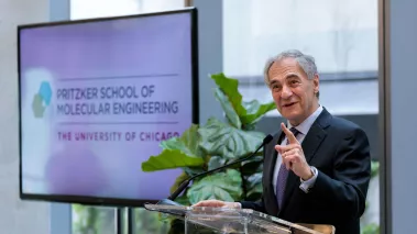 University of Chicago President Robert Zimmer speaks at a podium in 2019