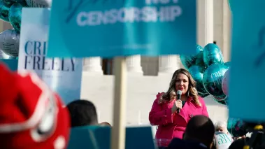 Lorie Smith, owner of 303 Creative, speakings in front of the Supreme Court