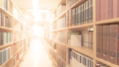 blurry room with bookshelves by defocused effect 