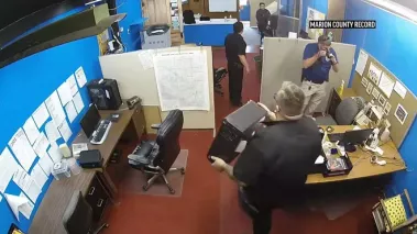 A police raid on a Kansas newspaper and the home of the paper's publisher is sparking a controversy centering on small-town politics and the First Amendment.