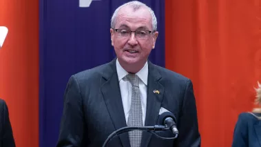 New Jersey Gov Phil Murphy speaking at a podium