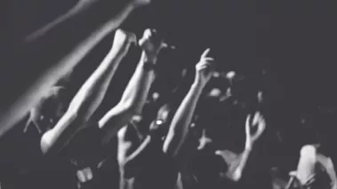 Silhouettes of people raised hands and shouting